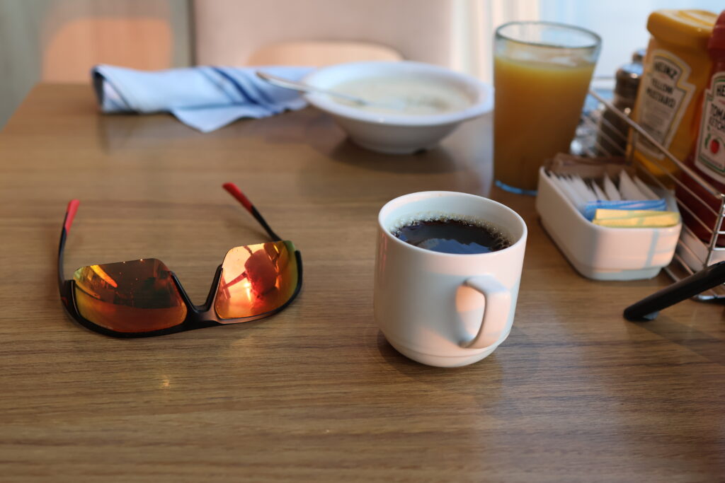 sunglasses and coffee cup on table